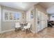 Charming breakfast nook featuring bright windows, white shutters, and a cozy table for two at 830 Cozette Ct # 102, Las Vegas, NV 89144