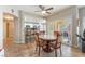 Eat-in kitchen with breakfast bar and dining area boasting tile flooring and neutral color palette at 830 Cozette Ct # 102, Las Vegas, NV 89144
