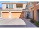 Spacious condo featuring two-car garage, a balcony, and manicured landscaping at 830 Cozette Ct # 102, Las Vegas, NV 89144