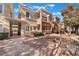 Exterior of a two-story home with a walkway and minimal landscaping at 830 Cozette Ct # 102, Las Vegas, NV 89144