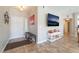 Inviting foyer featuring neutral colors, tile flooring, a bench and a stylish decor at 830 Cozette Ct # 102, Las Vegas, NV 89144