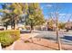 View of a community garage parking area with landscaping in the foreground at 830 Cozette Ct # 102, Las Vegas, NV 89144