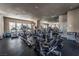 Well-equipped gym with cardio machines, free weights, and mirrors, promoting a healthy lifestyle for residents at 830 Cozette Ct # 102, Las Vegas, NV 89144