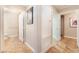 Hallway with tiled flooring, leading to a bathroom and other rooms at 830 Cozette Ct # 102, Las Vegas, NV 89144