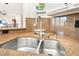 Kitchen sink features a stainless steel sink, cork counters, and chrome faucet at 830 Cozette Ct # 102, Las Vegas, NV 89144