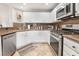 Well-appointed kitchen with stainless steel appliances, granite countertops, and ample cabinet space at 830 Cozette Ct # 102, Las Vegas, NV 89144