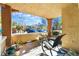 Overhead shot of a covered patio with lounge seating and landscaping at 830 Cozette Ct # 102, Las Vegas, NV 89144