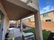 Covered back patio perfect for dining, relaxing, and entertaining, overlooking the green backyard at 8651 Moreno Mountain Ave, Las Vegas, NV 89178
