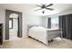 Bedroom with gray walls and a white bed frame with a white comforter, next to an en suite bath at 8651 Moreno Mountain Ave, Las Vegas, NV 89178
