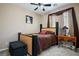 Cozy bedroom with neutral walls and carpet, complemented by a unique bedframe at 8651 Moreno Mountain Ave, Las Vegas, NV 89178