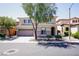 Charming two-story home featuring a well-manicured front yard and a spacious two-car garage at 8651 Moreno Mountain Ave, Las Vegas, NV 89178