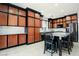 Modern kitchen features custom wood cabinetry, granite countertops, and stainless steel appliances at 8651 Moreno Mountain Ave, Las Vegas, NV 89178