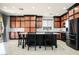 Spacious kitchen with island and seating, stainless steel appliances, and granite countertops at 8651 Moreno Mountain Ave, Las Vegas, NV 89178