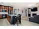 Open concept living area showcasing a modern kitchen, inviting seating, and lots of counter space at 8651 Moreno Mountain Ave, Las Vegas, NV 89178