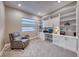 Bright home office with built-in white cabinets and shelving at 89 Mirage View Dr, Henderson, NV 89011