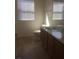 Clean bathroom, double vanity, and light brown wood cabinets at 8985 S Durango Dr # 2094, Las Vegas, NV 89113