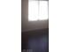 Bright bedroom with window and dark floors at 8985 S Durango Dr # 2094, Las Vegas, NV 89113