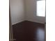 Bright bedroom with dark hardwood floors and window coverings at 8985 S Durango Dr # 2094, Las Vegas, NV 89113