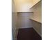 Walk-in closet with shelving and dark floors at 8985 S Durango Dr # 2094, Las Vegas, NV 89113