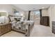 Relaxing bedroom with a wood bed frame and dresser at 8992 Sparkling River Ct, Las Vegas, NV 89178