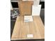 Sample of interior home finishes including upgraded cabinets and luxury vinyl plank flooring at 9156 Benton Woods St, Las Vegas, NV 89113