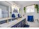 Upgraded bathroom features double sinks with modern light fixtures and decor at 10654 Sidlaw Hills Ct, Las Vegas, NV 89141