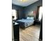 Inviting bedroom shows a comfy bed and a minimalistic night stand setup at 10654 Sidlaw Hills Ct, Las Vegas, NV 89141