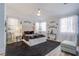 Bedroom featuring a bed with decorative pillows and large windows for natural light at 10654 Sidlaw Hills Ct, Las Vegas, NV 89141