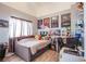 Cozy bedroom shows a comfortable bed with a workspace and decor at 10654 Sidlaw Hills Ct, Las Vegas, NV 89141