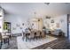 Elegant dining room with seating for eight, modern decor, and hardwood floors at 10654 Sidlaw Hills Ct, Las Vegas, NV 89141