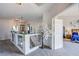 Hallway landing featuring a decorative tree and doorway to bedroom at 10654 Sidlaw Hills Ct, Las Vegas, NV 89141
