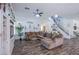 Comfortable living room with plush seating, hardwood floors, and a staircase at 10654 Sidlaw Hills Ct, Las Vegas, NV 89141
