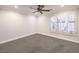 Spacious bedroom with ceiling fan and large window with shutters at 1240 Fragrant Spruce Ave, Las Vegas, NV 89123