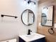 Stylish bathroom with wood-look walls and a vanity at 1470 Sutton Dr, Pahrump, NV 89048
