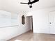 Bright bedroom with ceiling fan and neutral decor at 1470 Sutton Dr, Pahrump, NV 89048
