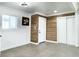 Bright entryway with wood-look wall accents, tile flooring, and a closet at 1470 Sutton Dr, Pahrump, NV 89048