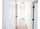 Clean and bright hallway with neutral-colored walls and tile flooring at 1470 Sutton Dr, Pahrump, NV 89048