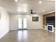 Spacious living area with tile floors, a fireplace, and access to the backyard at 1470 Sutton Dr, Pahrump, NV 89048