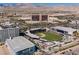 Aerial shot of Las Vegas Ballpark, surrounded by commercial buildings, parking garages, and palm trees in Nevada at 1901 Shady Elm St, Las Vegas, NV 89135