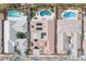 An aerial view of neighborhood homes with pools and solar panels in a suburban community at 1901 Shady Elm St, Las Vegas, NV 89135