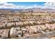 This is an aerial view of neighborhood single-Gathering homes with solar panels on the roofs at 1901 Shady Elm St, Las Vegas, NV 89135