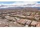 An aerial view of neighborhood homes with solar panels set against a mountain backdrop at 1901 Shady Elm St, Las Vegas, NV 89135