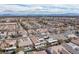 An aerial view of a neighborhood with pools, manicured lawns, and solar panels on the roofs in Las Vegas, Nevada at 1901 Shady Elm St, Las Vegas, NV 89135
