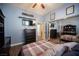 Comfortable bedroom with laminate floors, an open closet and a plaid bedspread at 1901 Shady Elm St, Las Vegas, NV 89135