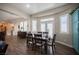 Elegant dining area with shuttered windows, seamlessly connected to the living spaces at 1901 Shady Elm St, Las Vegas, NV 89135