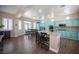 Bright kitchen featuring a large island with seating, stainless appliances, and plenty of counter space at 1901 Shady Elm St, Las Vegas, NV 89135
