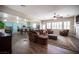 Open-concept living room featuring a ceiling fan and seamless flow into the kitchen at 1901 Shady Elm St, Las Vegas, NV 89135