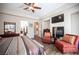Relaxing main bedroom featuring a cozy sitting area with a fireplace and TV at 1901 Shady Elm St, Las Vegas, NV 89135