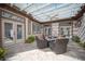 Inviting outdoor patio area with a pergola, ceiling fan, and comfortable wicker seating at 1901 Shady Elm St, Las Vegas, NV 89135