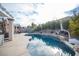 Resort-style pool with a rock waterfall feature and a basketball hoop for outdoor fun at 1901 Shady Elm St, Las Vegas, NV 89135